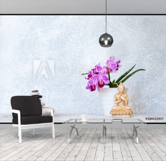 Picture of Buddha pyramid of pebbles and orchid flower as zen background